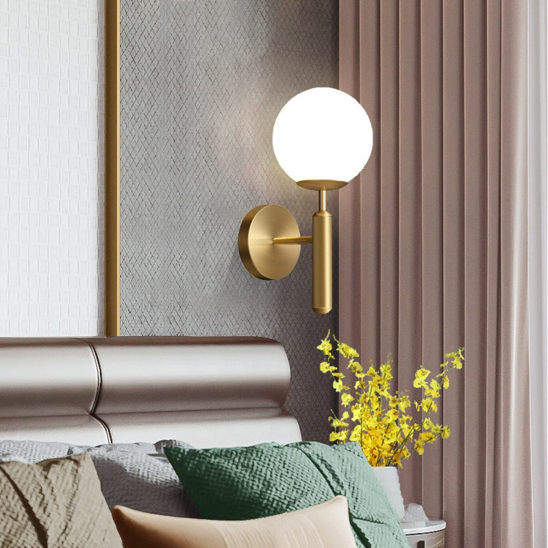 Kestrel Upright Milky Glass Ball LED Wall Sconce in Brushed Brass Finish, Mid-Century Modern Style - OpalDwell