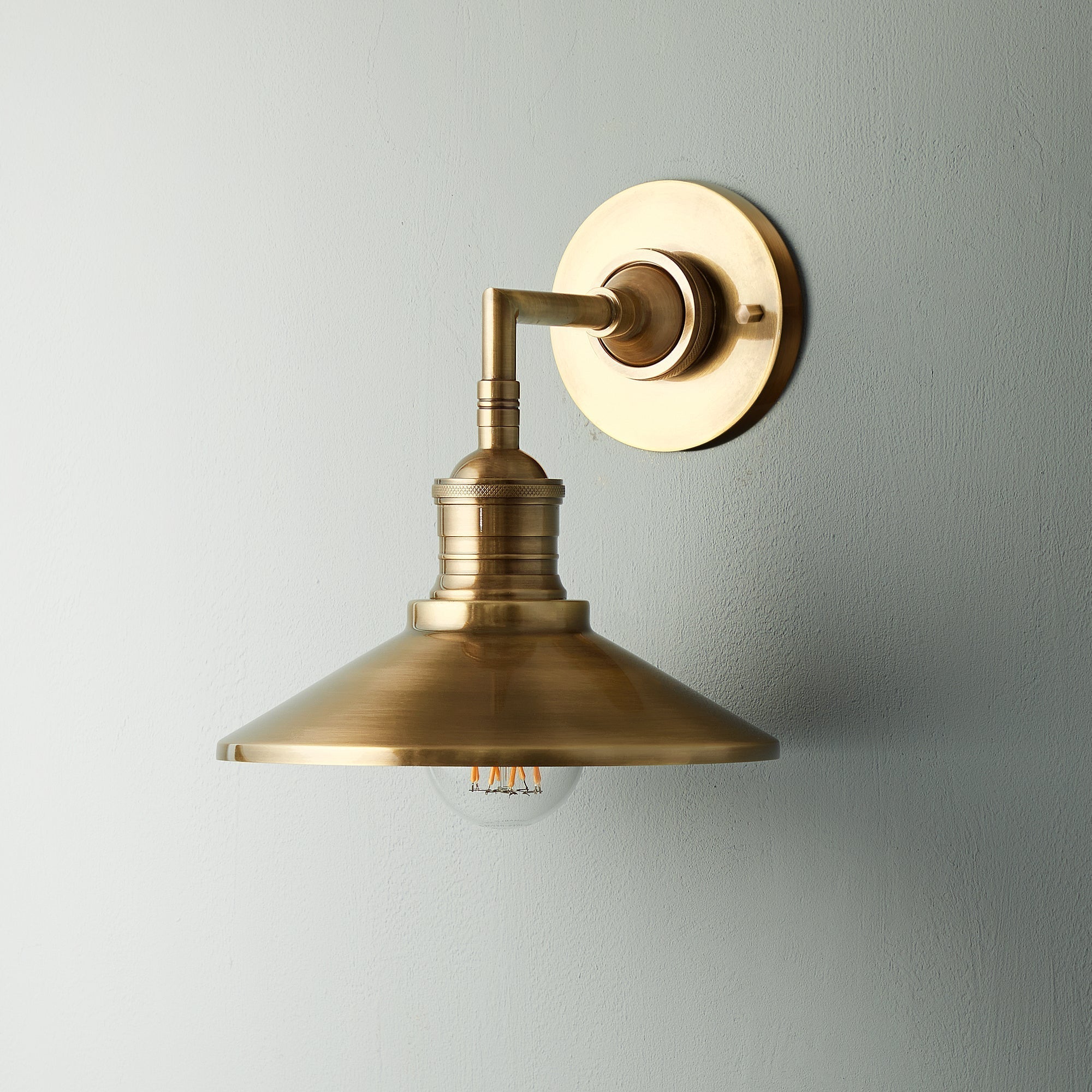 Lyra Antique Brass Wall Lamp With Cone Shade Exposed Bulb - OpalDwell