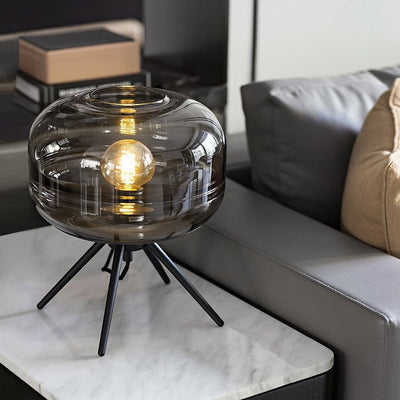 Lyra Smoked Glass Table Lamp With Modern Tripod Design - OpalDwell