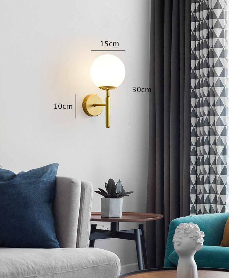 Kestrel Upright Milky Glass Ball LED Wall Sconce in Brushed Brass Finish, Mid-Century Modern Style - OpalDwell