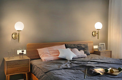 Kestrel Upright Milky Glass Ball LED Wall Sconce in Brushed Brass Finish, Mid-Century Modern Style - OpalDwell