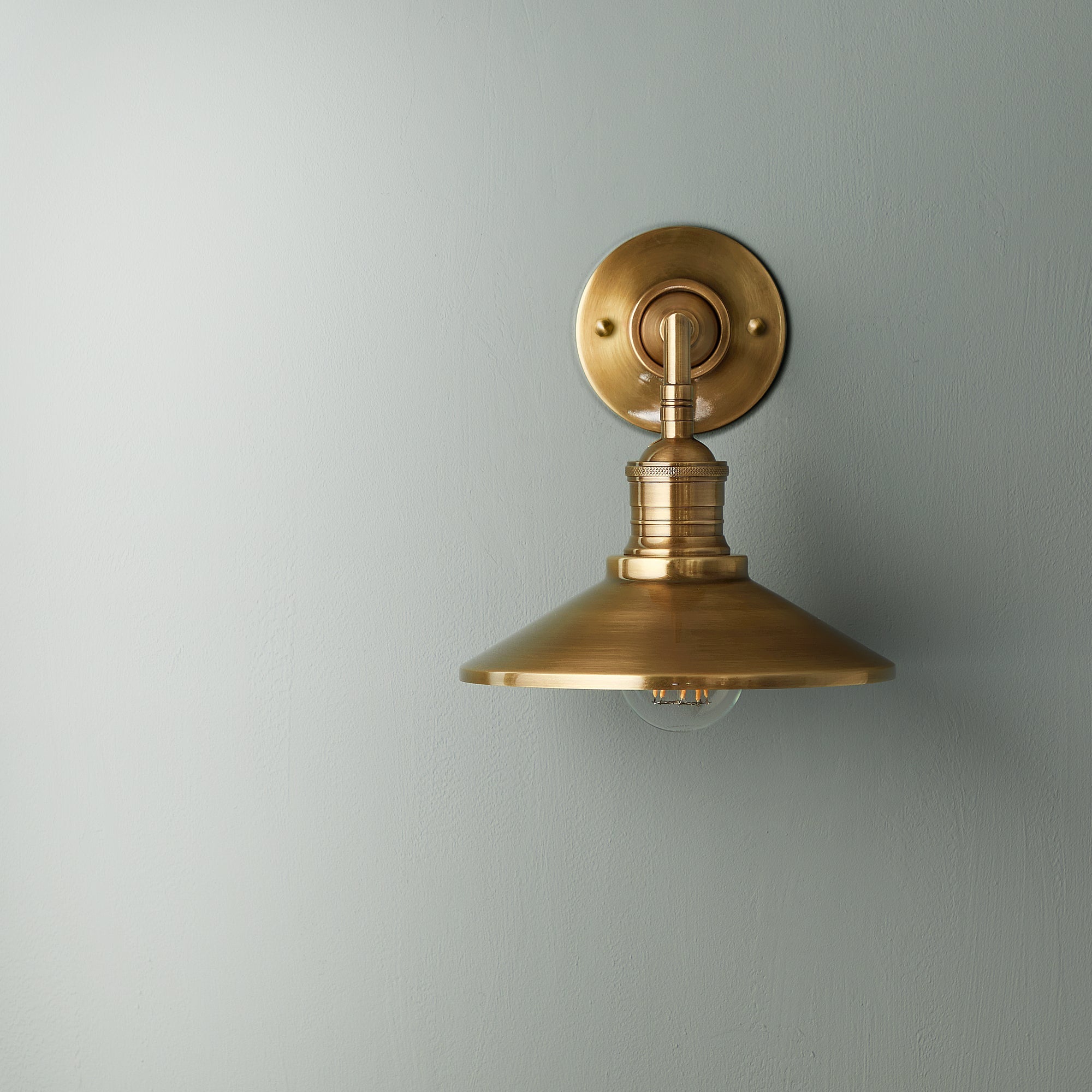 Lyra Antique Brass Wall Lamp With Cone Shade Exposed Bulb - OpalDwell